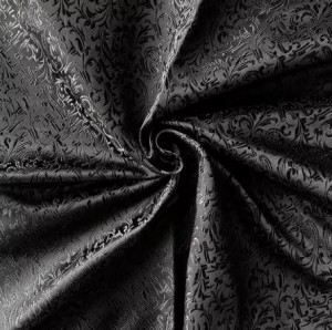 Black Jacquard Fabric with a Delicate Flowing Pattern (note: width 28")